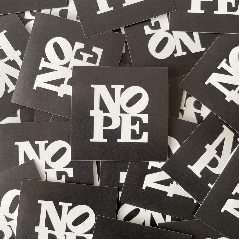 A collection of NOPE stickers